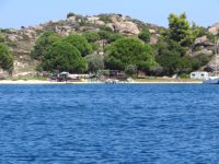 Many boats visit the island Diaporos, which is across the Vourvourou beach
