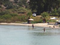 Latoura beach features shallow waters and is located just before Vourvourou in Sithonia, Chalkidiki