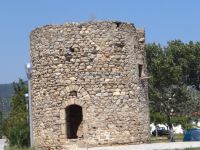 Stone tower right by the sea at the village Paralia Sykias