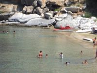 Rocks and fine sand at the beach Tourkolimnionas close to beach of Sykia