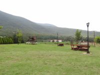Recreation area with wooden benches in the village Agistro, Serres