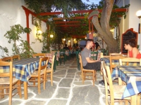 Alley with restaurants in the center of the village Kastro in Sikinos