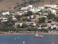 The houses are built on the hill above the beach at Kini 