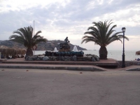 The monument on the seafront in Kini is dedicated to those who died at sea