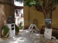 The bust of local author Velissarios Freris in the square of Agios Antonios in Ano Syros