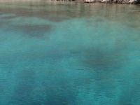 Crystal clear waters on the beach Grammata in north Syros